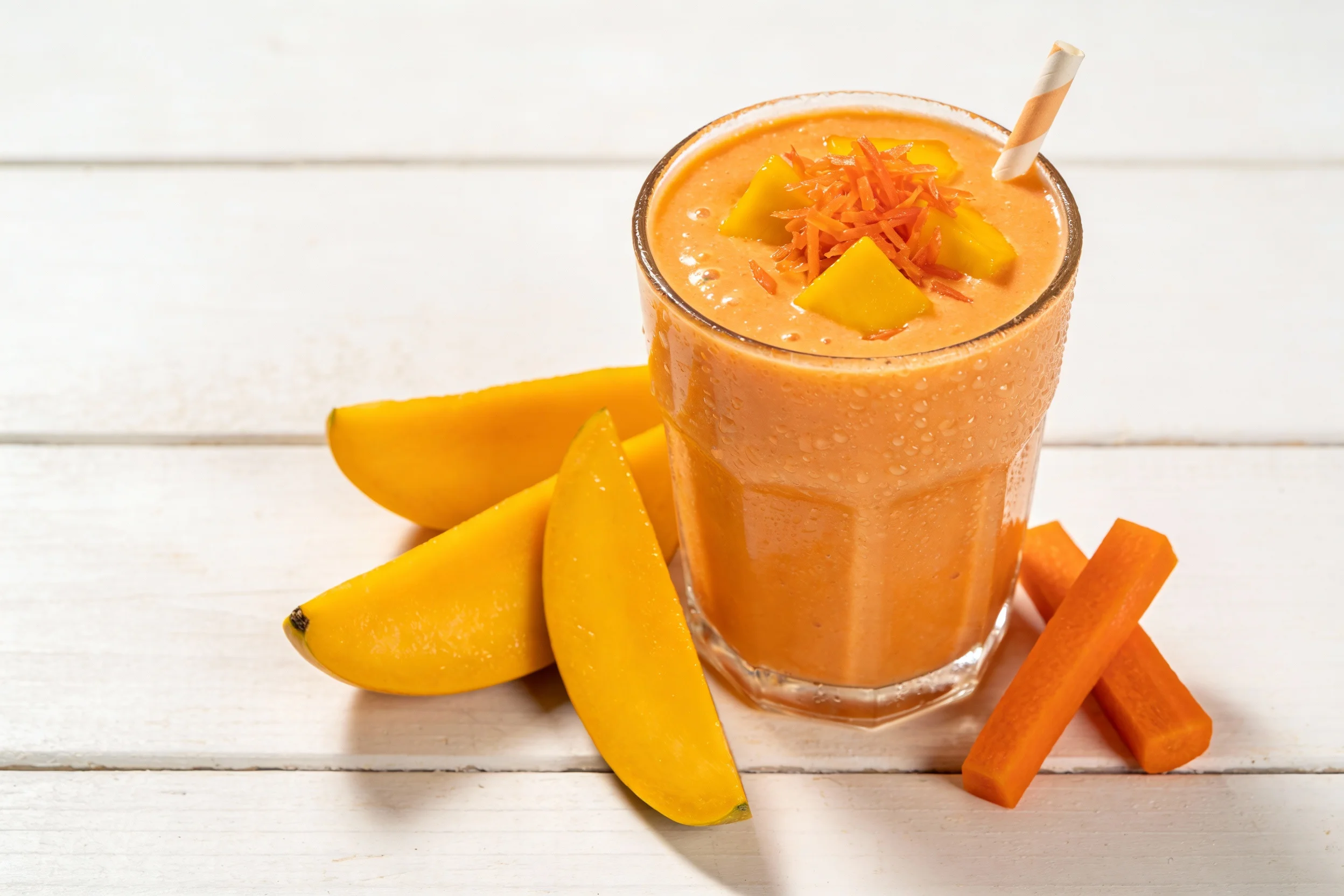 Orange smoothie with mangoes and carrots